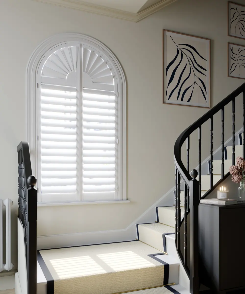 shaped shutters at window