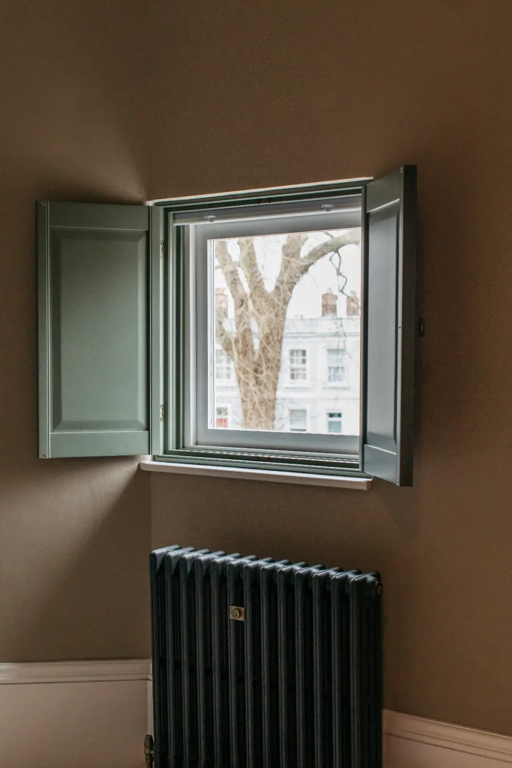 Solid raised solid panel shutters open fully